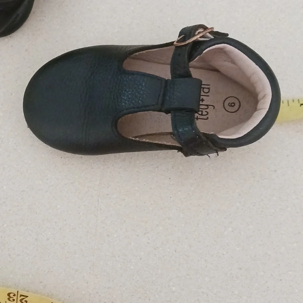 Teg+Lai  T Strap Black Rubber Flex Sole Shoes